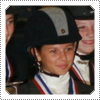 Mack posing with her fellow horse-jumping team after winning 1st place in a big championship competition in 2006.